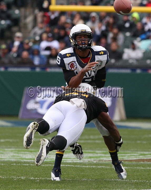 122912 Kraft SA-036.JPG - Dec 29, 2012; San Francisco, CA, USA; Navy Midshipmen quarterback Keenan Reynolds (19) is tackled by Chris Young (21) against the Arizona State Sun Devils in the 2012 Kraft Fighting Hunger Bowl at AT&T Park.